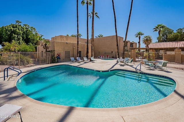 view of swimming pool featuring a patio