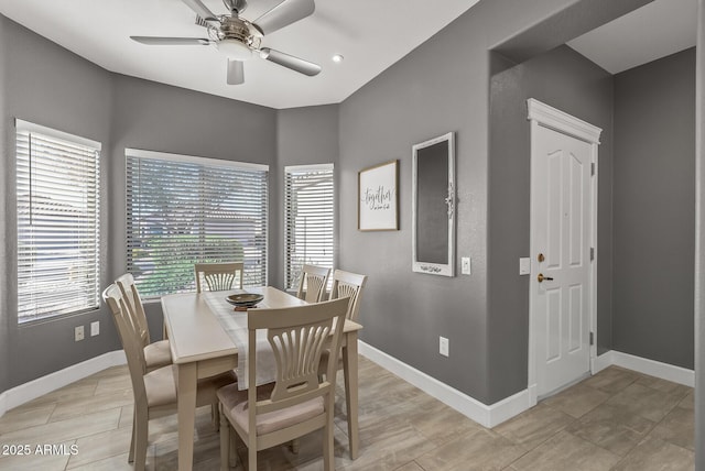 dining area featuring a ceiling fan and baseboards