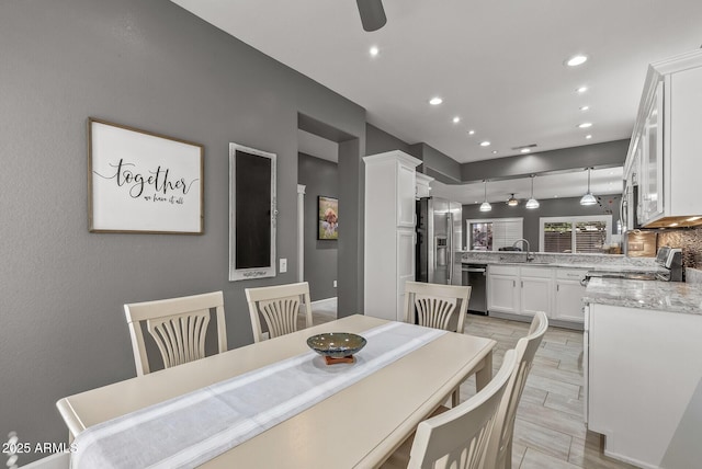 dining area with recessed lighting, a ceiling fan, and wood tiled floor