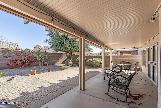 view of patio / terrace featuring outdoor dining area and a fenced backyard