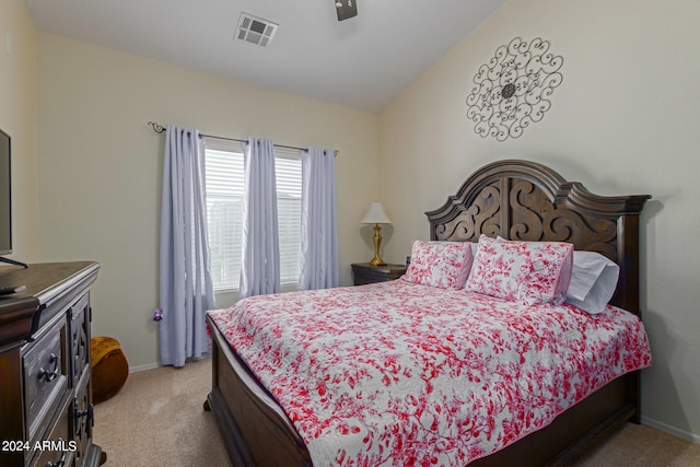 carpeted bedroom with lofted ceiling and ceiling fan