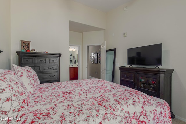 carpeted bedroom featuring connected bathroom