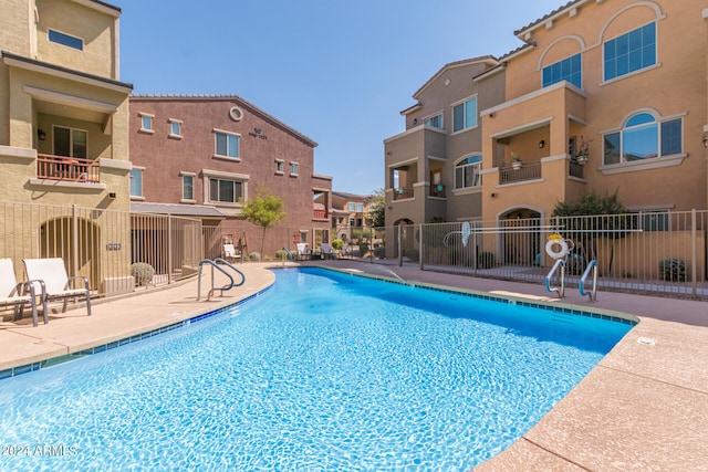 view of swimming pool with a patio