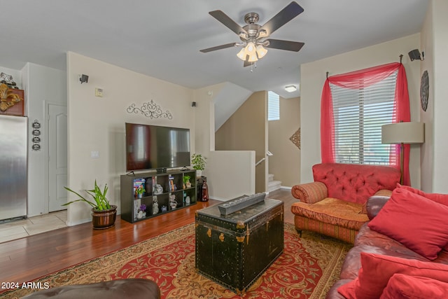 living room with ceiling fan and hardwood / wood-style flooring