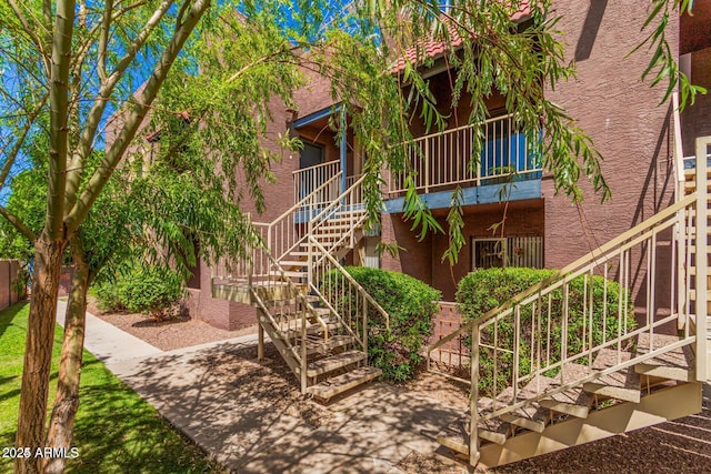 view of property featuring stairway