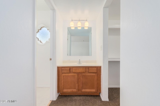 bathroom featuring vanity and baseboards