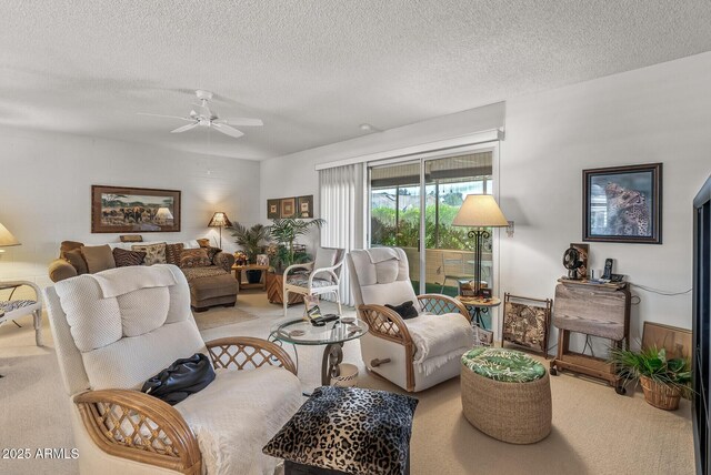 living area featuring light carpet, ceiling fan, and a textured ceiling