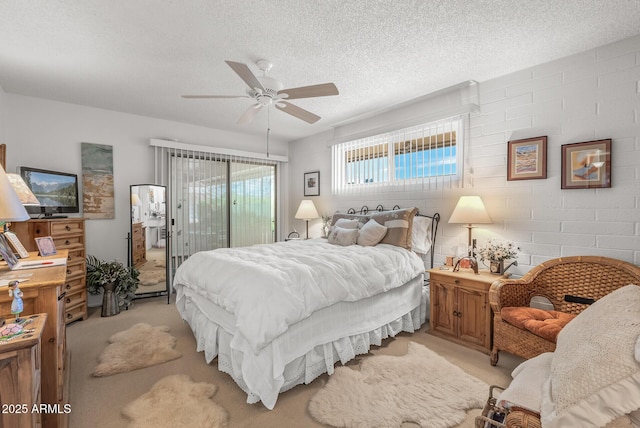 bedroom featuring light carpet, access to exterior, a ceiling fan, and a textured ceiling