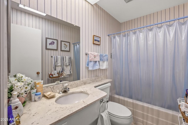 full bathroom featuring shower / tub combo, vanity, toilet, and wallpapered walls