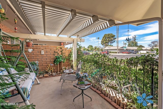 view of patio with fence and a pergola