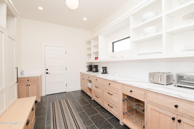 kitchen featuring decorative backsplash, light stone counters, light brown cabinets, open shelves, and recessed lighting