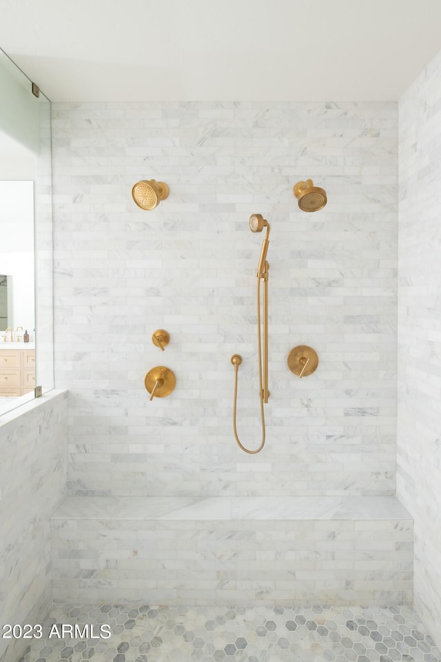 full bath featuring a tile shower