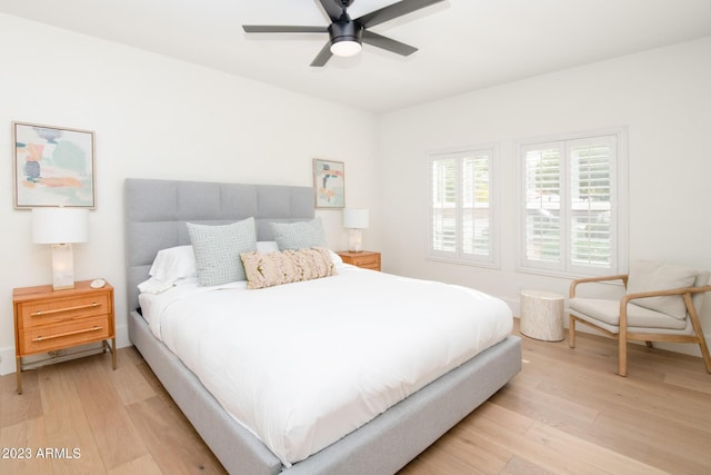 bedroom with light wood-type flooring and ceiling fan