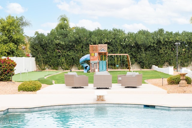 pool featuring a patio, playground community, and a fenced backyard