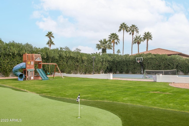 community play area with a yard and community basketball court