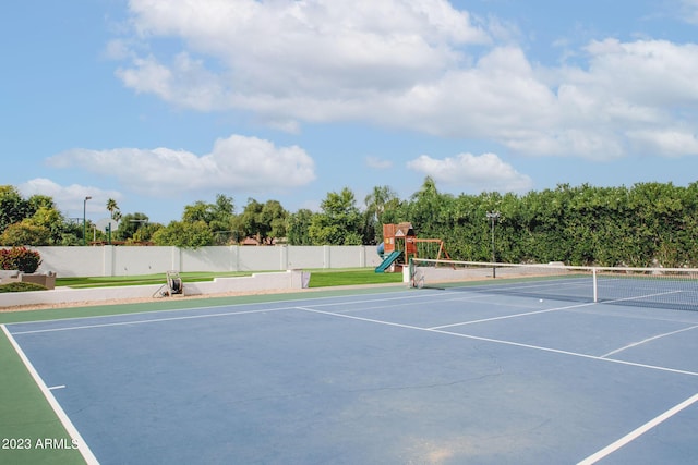 view of sport court with playground community and fence