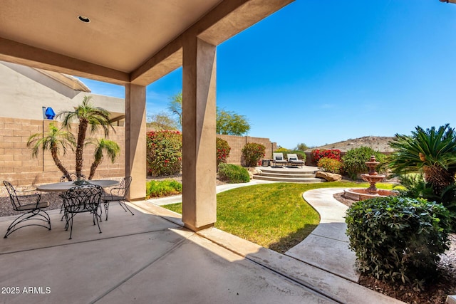 view of patio / terrace with outdoor dining area and a fenced backyard