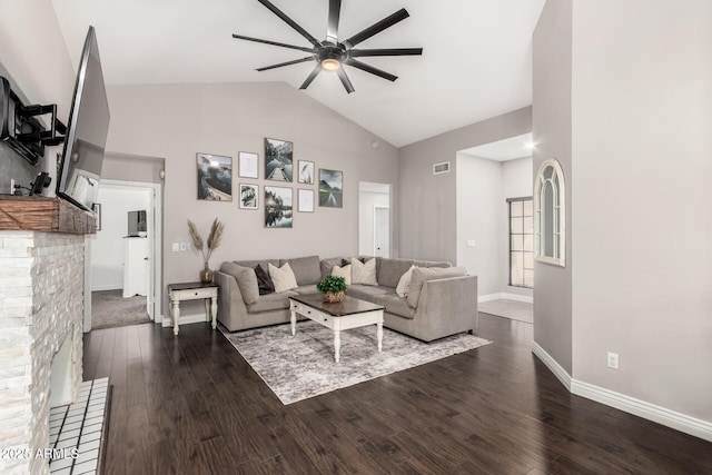 living area with high vaulted ceiling, visible vents, baseboards, a ceiling fan, and dark wood-style floors