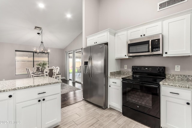 kitchen with visible vents, appliances with stainless steel finishes, white cabinets, and wood finish floors