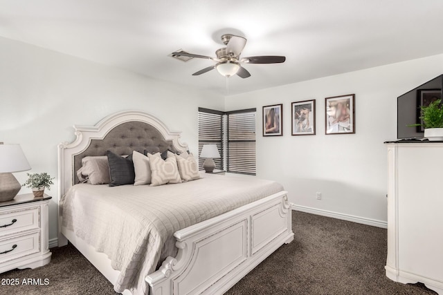 bedroom with baseboards, dark carpet, and ceiling fan