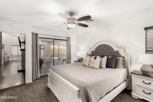 bedroom with a ceiling fan, access to outside, visible vents, and dark carpet