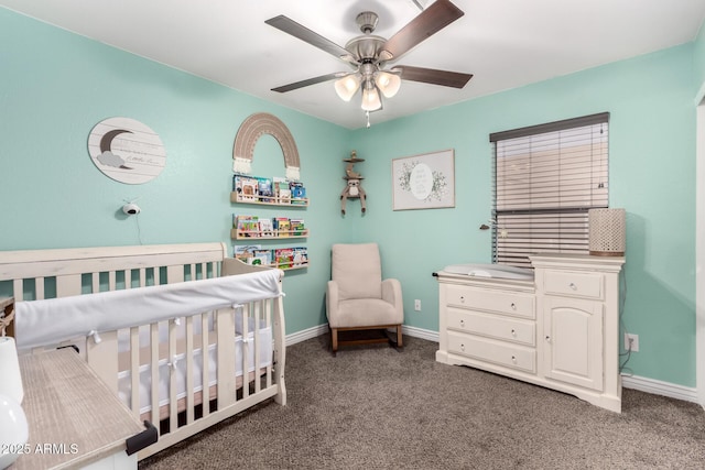 bedroom featuring a crib, carpet, and baseboards