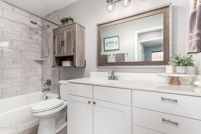 full bath featuring  shower combination, vanity, and toilet