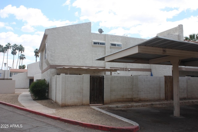 view of home's exterior with a carport