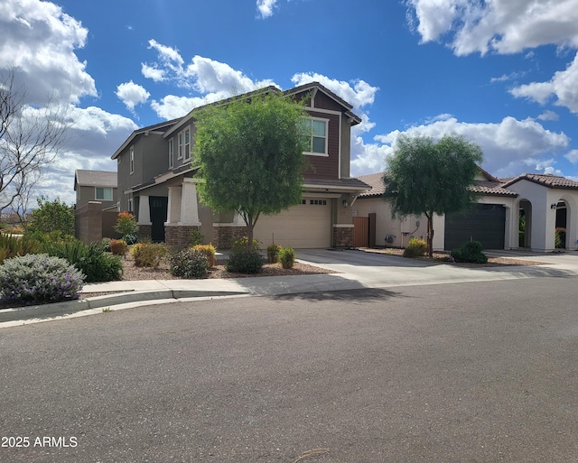 view of front of home with a tiled roof, stucco siding, driveway, and an attached garage