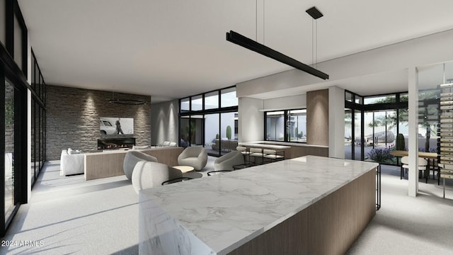 kitchen featuring a fireplace and pendant lighting