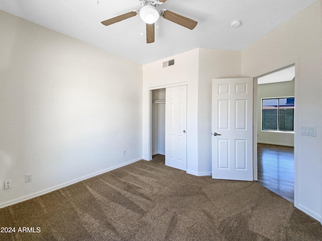 unfurnished bedroom with a ceiling fan, baseboards, visible vents, a closet, and carpet flooring