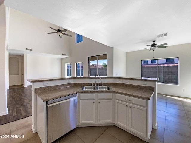 kitchen featuring visible vents, a kitchen island with sink, a sink, dishwasher, and open floor plan