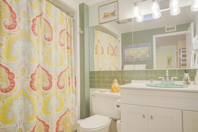 bathroom with toilet, vanity, tile walls, decorative backsplash, and a shower with curtain