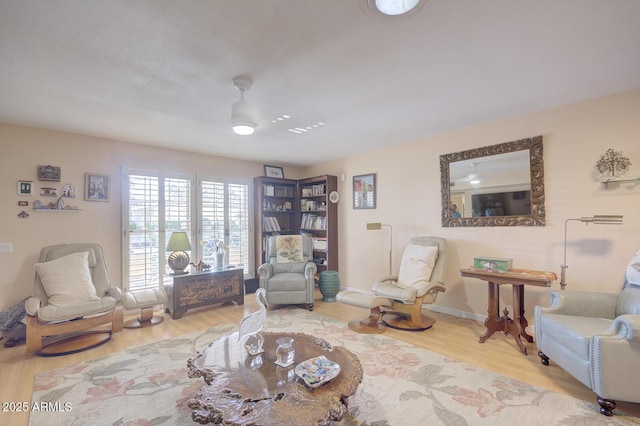 living area with hardwood / wood-style floors