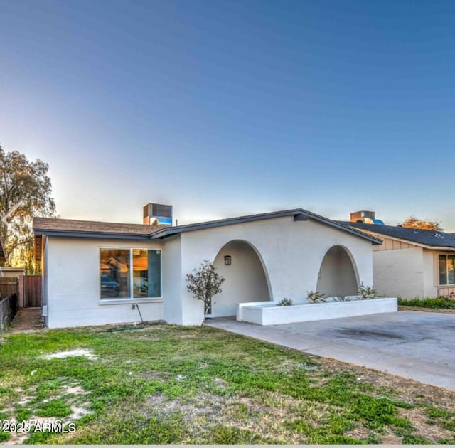 5222 N 41st Ave, Phoenix, AZ 85019 - view of front of home featuring stucco siding and a chimney