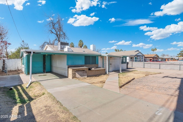 single story home with a carport