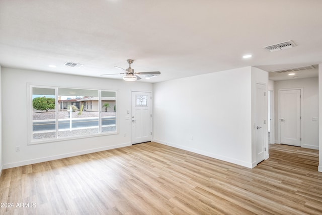 spare room with ceiling fan and light hardwood / wood-style floors