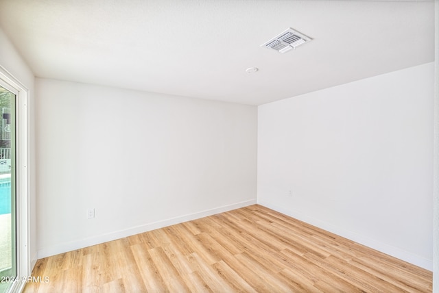 unfurnished room featuring light wood-type flooring