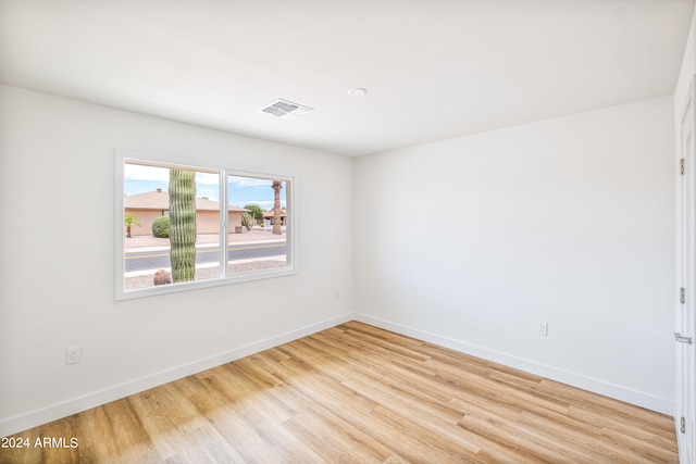 unfurnished room featuring light hardwood / wood-style floors