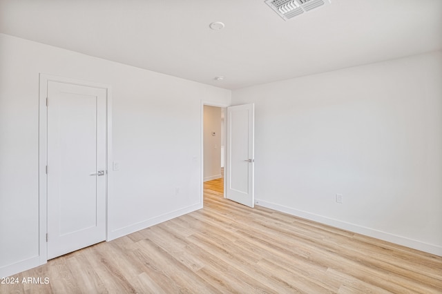 spare room with light hardwood / wood-style floors