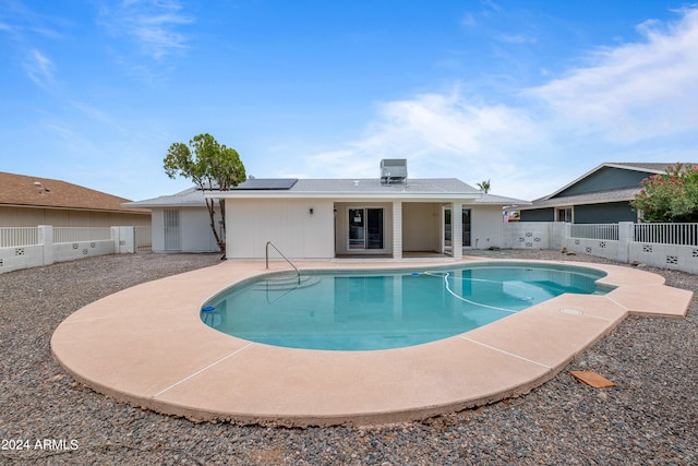 view of pool featuring central air condition unit and a patio