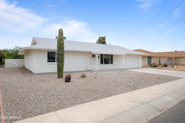 single story home featuring a garage