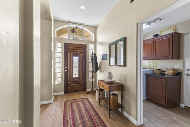 entryway with light hardwood / wood-style flooring