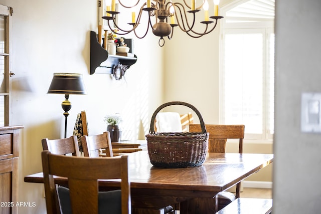 dining space featuring an inviting chandelier