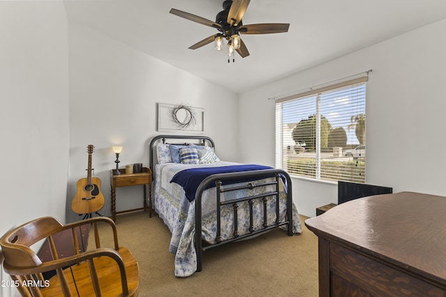 bedroom featuring ceiling fan, lofted ceiling, and light carpet