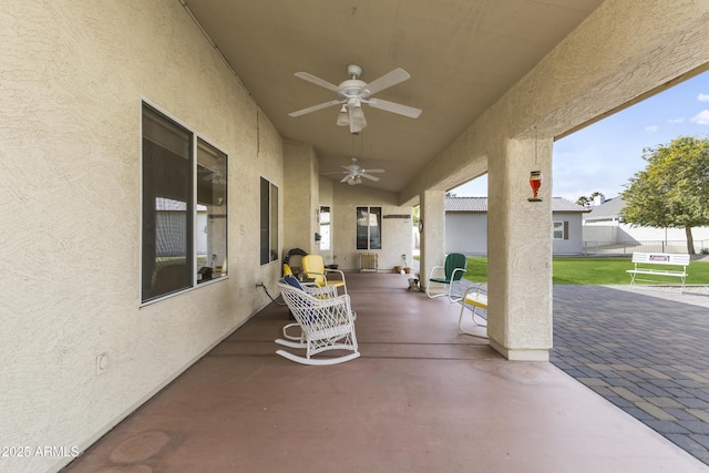 view of patio with ceiling fan