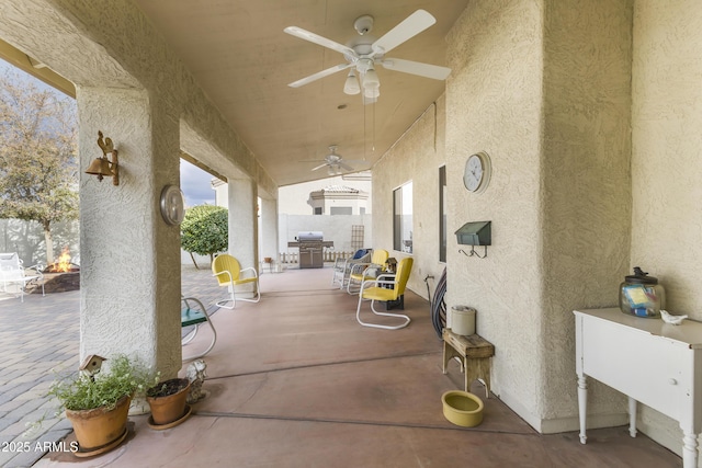 view of patio featuring ceiling fan