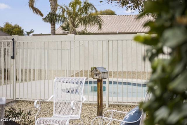 exterior space featuring a fenced in pool