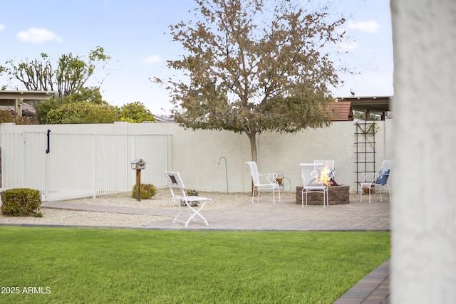 view of yard featuring a patio area and a fire pit