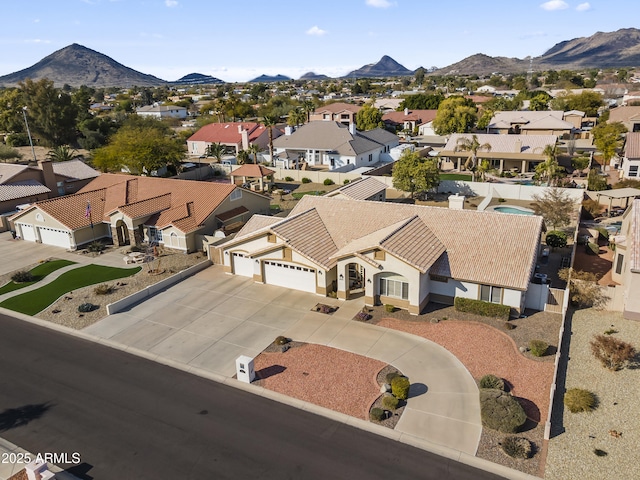 birds eye view of property with a mountain view